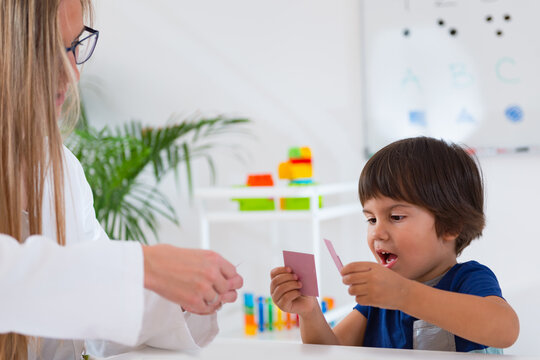 Child psychology, toddler doing logic tests with cards
