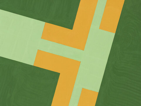Aerial view of a sports field under construction with colorful geometric patterns and green and orange paint in Taiwan.