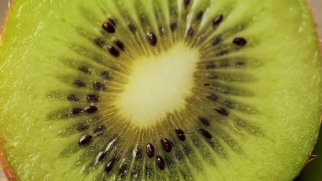 Close-up of kiwi fruit slices. Fresh and healthy fruit. Kiwi is low in calories and high in fiber, making a good choice for weight management. High quality 4k footage
