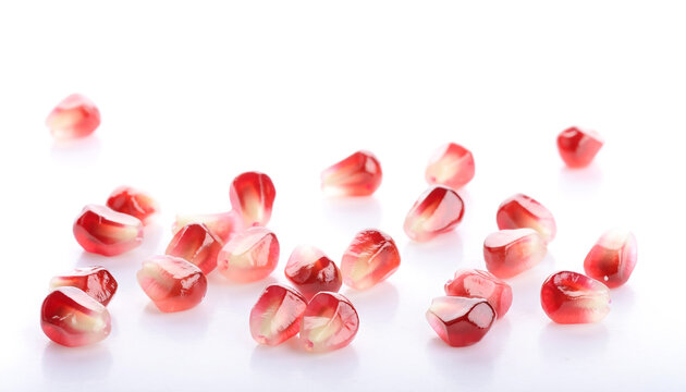 Fresh pomegranate seeds isolated on white background