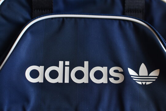 the Adidas logo on a mini airliner bag 