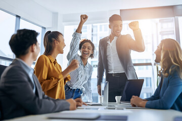 Fototapeta premium Startup team celebrating success in modern office