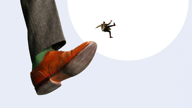 Tiny businessman falling after being kicked by giant shoe concept of rejection and instability. Concept of job loss, career risk, instability, sudden change and uncertainty in professional life.