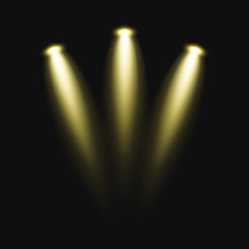 Three golden spotlights illuminating darkness