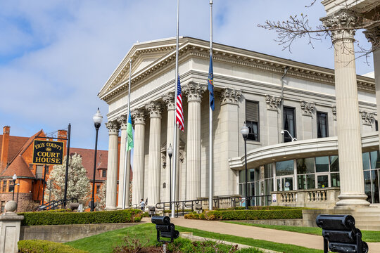 Erie County Courthouse building with American and state flags flying on a sunny day; Erie, Pennsylvania April 17, 2026