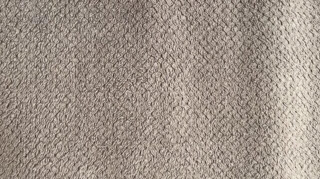 Close-up of Soft Grey Microfiber Fabric Texture with Detailed Fiber Patterns