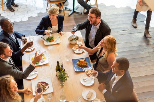 Diverse group enjoying dinner photo