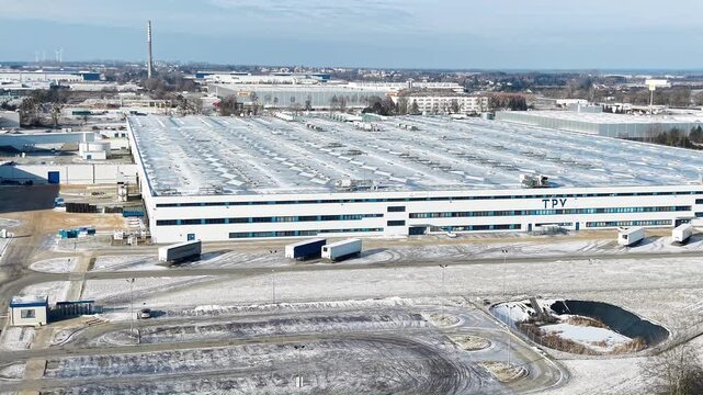 Aerial view of TPV Poland in winter season. TPV Displays Polska in Gorz&oacute;w Wielkopolski, established in 2007&ndash;2008, is the sole European manufacturing hub for TPV Technology, producing LCD, miniLED, and