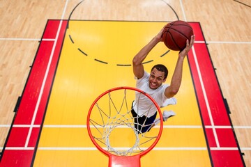 Basketball player dunking hoop photo © Rawpixel.com