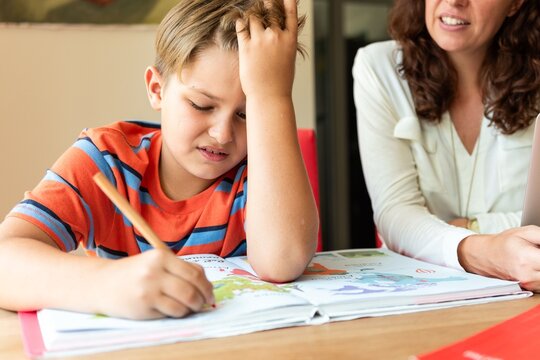 Child learning with adult guidance.