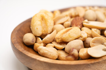Fototapeta premium Assorted nuts snack mix with peanuts almonds and crackers