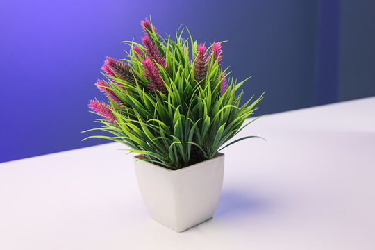 Vibrant Artificial Potted Plant with Purple and Green Foliage in Minimalist White Pot