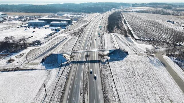 Aerial drone view of S3 expressway in eastern Poland covered in snow. Gorz&oacute;w Wielkopolski