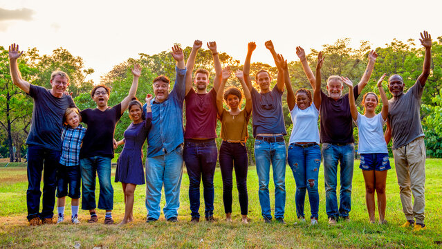 Diverse group celebrating unity outdoors
