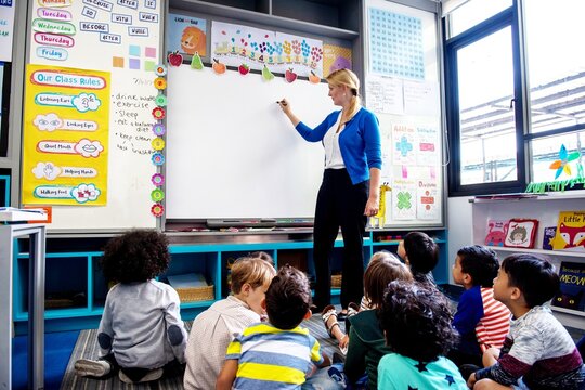 Teacher engaging students in classroom.