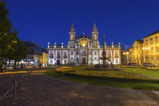 Carlos Amarante square at sunset with illuminated 18th century Sao Marcos Church and former hospital converted into an hotel, Braga, Minho, Portugal