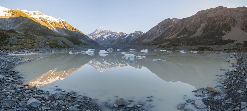 Sunrise, reflection in Hooker Lake, morning sun illuminating Mount Cook, Mount Cook National Park, Southern Alps, Hooker Valley, Canterbury, South Island, New Zealand
