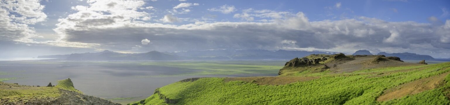 View from Hj&ouml;rleifsh&ouml;fdi (Viking grave) over wide lava sand area to Vik, M&yacute;rdalur, Su&eth;urland, Iceland