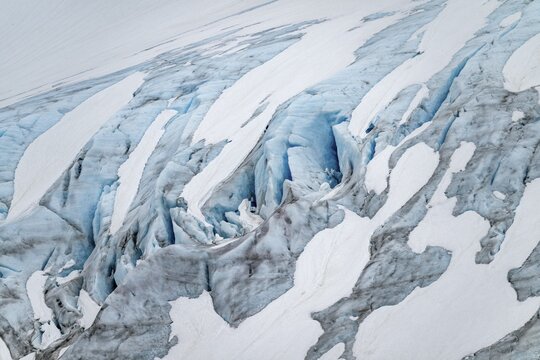 Blue rugged glacier ice with crevasses and snow, detail, Exit Glacier, Kenai Peninsula, Alaska, USA
