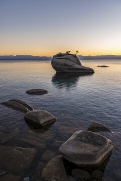 Bonsai Rock, small tree on a rock in the water, sunset, Lake Tahoe, California, USA