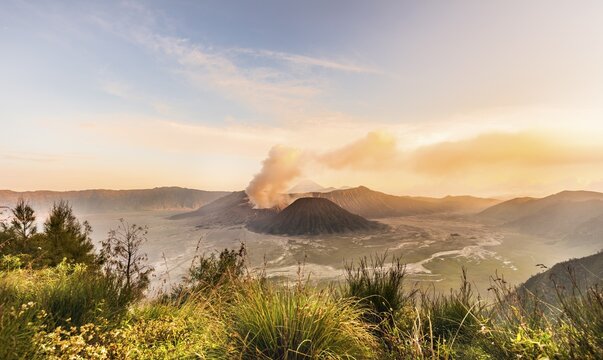 Sunrise, smoking volcano, Gunung Bromo, Mount Batok, Mount Kursi, Mount Semeru, Bromo Tengger Semeru National Park, Java, Indonesia