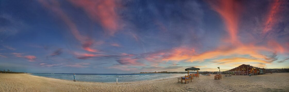 Sandy beach beach and coral reef Abu-Dabbab at sunset, Hilton Nubian Resort, Al Qusair, Marsa Alam, Egypt