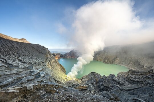 Volcano Kawah Ijen, volcanic crater with crater lake and steaming vents, morning light, Banyuwangi, Sempol, Jawa Timur, Indonesia