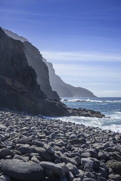 The beach framed by rocks at Playa del Trigo, Alojera, La Gomera, Spain