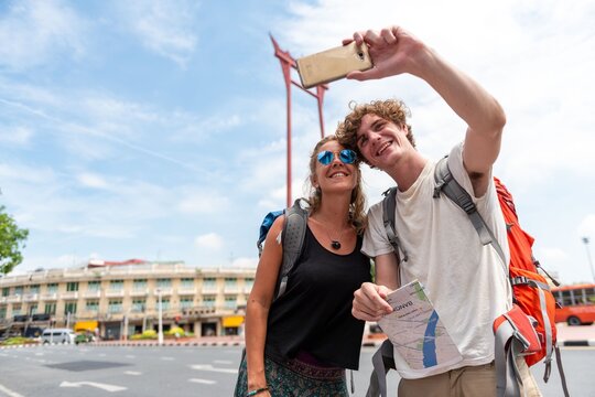 Travelers capturing memories together photo