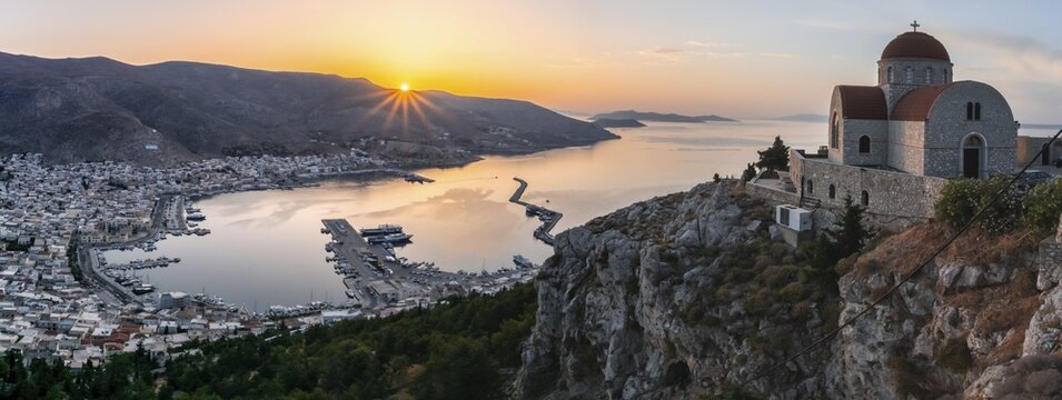 Sunrise, greek-orthodox monastery Saint Savvas, town view of Kalymnos, harbour and sea, Kalymnos, Dodecanese, Greece
