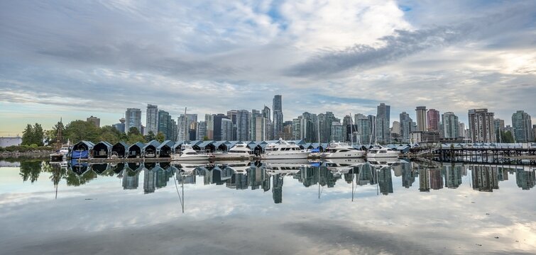 Skyscrapers and sailboats in the marina, skyline of Vancouver reflected in the sea, Coal Harbour, Downton Vancouver, British Columbia, Canada