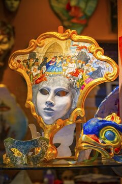 Venetian carnival masks in a shop window, Venice, Veneto, Italy