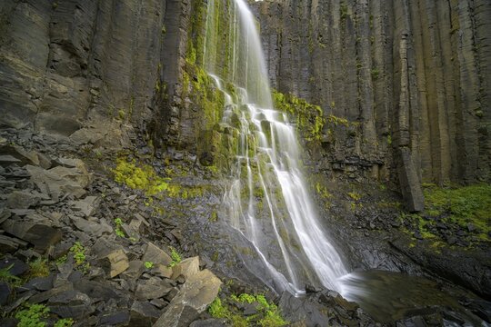 Waterfall framed by basalt columns, path to Stu&eth;lagil Canyon, Egilssta&eth;ir, Austurland, Iceland