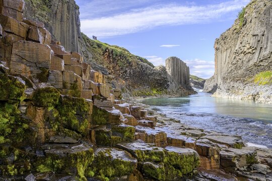 Basalt columns coloured orange by iron oxide, Stu&eth;lagil Canyon, Egilssta&eth;ir, Austurland, Iceland