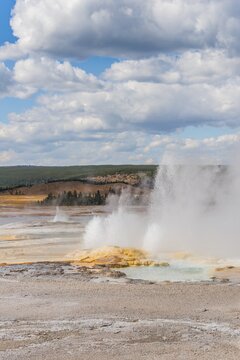 Steaming geyser with water fountain, Spouter Geyser, Black Sand Basin, Yellowstone National Park, Wyoming, USA