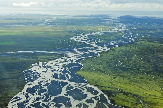 Aerial view, glacial river meandering over the sandy surface of the Skei&eth;ar&aacute;rsandur desert plain, Vatnajoekull and Skaftafell National Park, Southern Region, Iceland