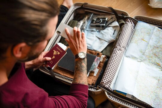 Traveler packing essentials suitcase photo
