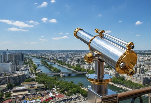 Telescope on the Eiffel Tower, view of the city with river Seine, Paris, France