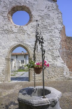 Fountain at the ruins of the church that collapsed in the 1976 earthquake, Venzone, province of Udine, Italy