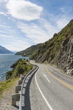 Road leads on Lake Wakatipu along Devils Staircase, Otago, Southland, New Zealand