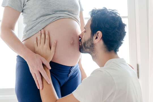 Tender moment expecting parents love