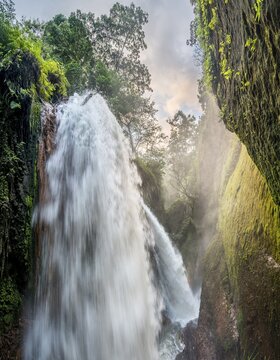Waterfall in ravine, Air Terjun Belawan, Kalianyar, Sempol, Eastern Java, Indonesia