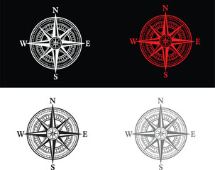 Four different colored and styled compass rose navigation charts © sweet vector