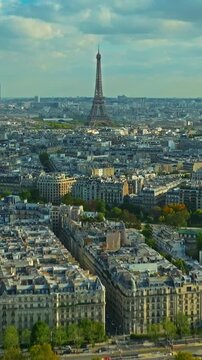 Aerial panning view of the historic center of Paris with the Eiffel Tower at summer day. Panorama of Paris from above. Aerial View on Eiffel Tower and Champ de Mars