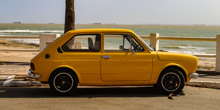 A yellow Fiat 147, the first car model produced by Fiat in Brazil between 1976 and 1986, based on the Italian 127, parked in S&atilde;o Lu&iacute;s, Maranh&atilde;o, Brazil.