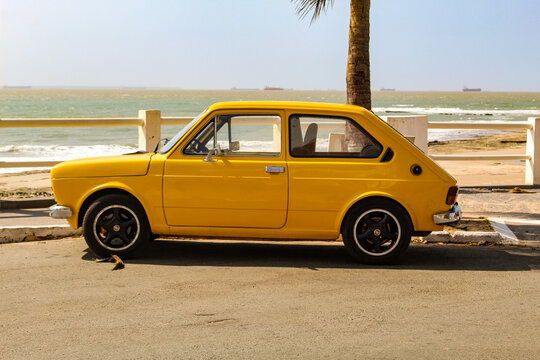 A yellow Fiat 147, the first car model produced by Fiat in Brazil between 1976 and 1986, based on the Italian 127, parked in S&atilde;o Lu&iacute;s, Maranh&atilde;o, Brazil.