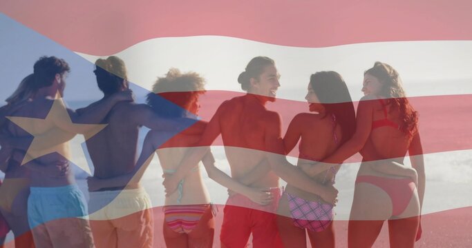 Standing eight adults linking arms on sandy shore, wearing swimwear under Puerto Rican flag overlay