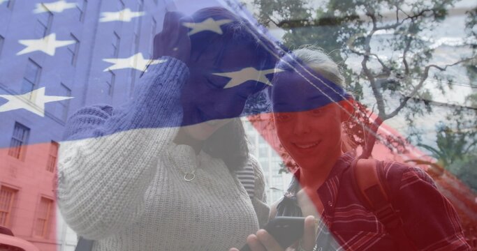 Vertical video: 2 teen peers tapping phone on street initiating American flag overlay for education