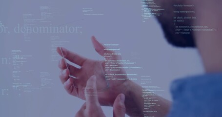 Fototapeta premium Interacting developer hands manipulating code overlay in studio workspace, wearing light blue shirt