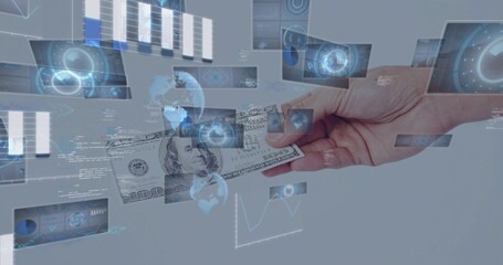 Fototapeta premium Holding US $100 bill, right hand with bare wrist offering amid studio HUD panels and graphs